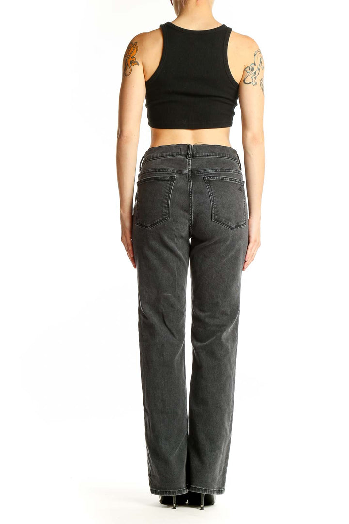 Side view of DL1961 charcoal gray straight leg jeans on model