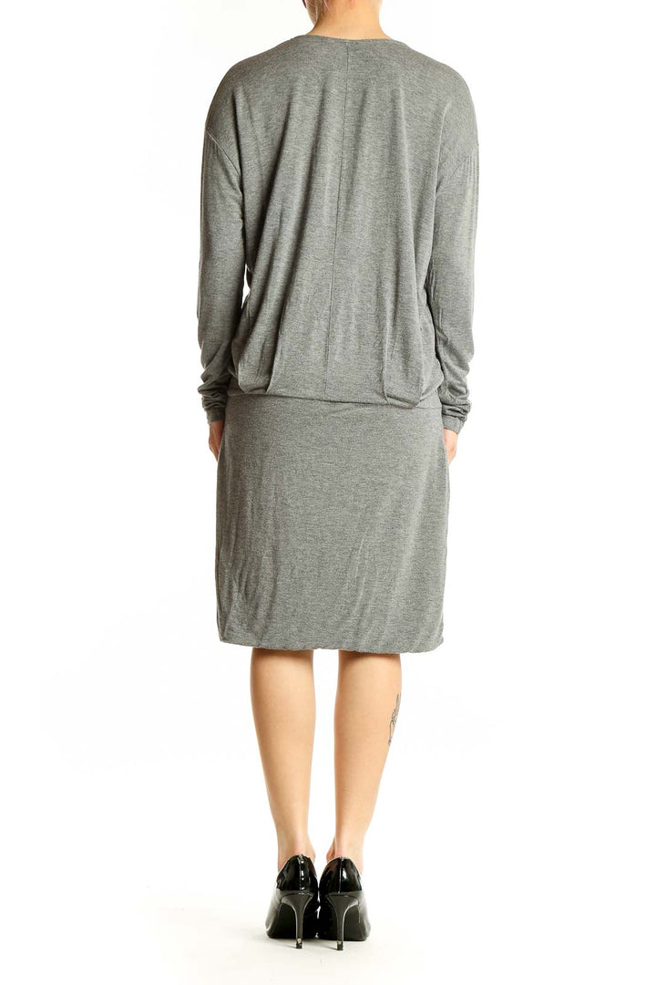 Side view of gray V-neck long sleeve midi dress from Banana Republic