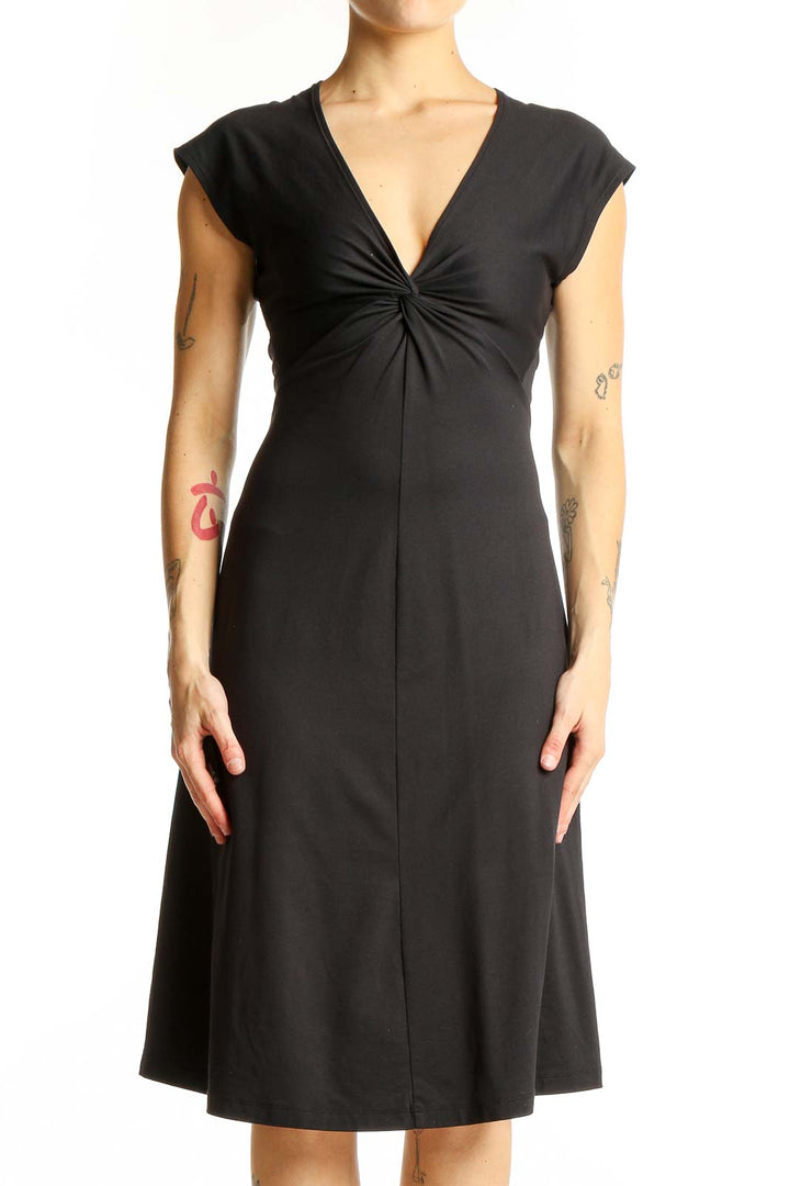 Front view of black Patagonia V-neck midi dress with twist-front detail