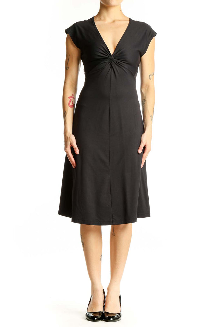 Front view of black Patagonia V-neck midi dress with twist-front detail