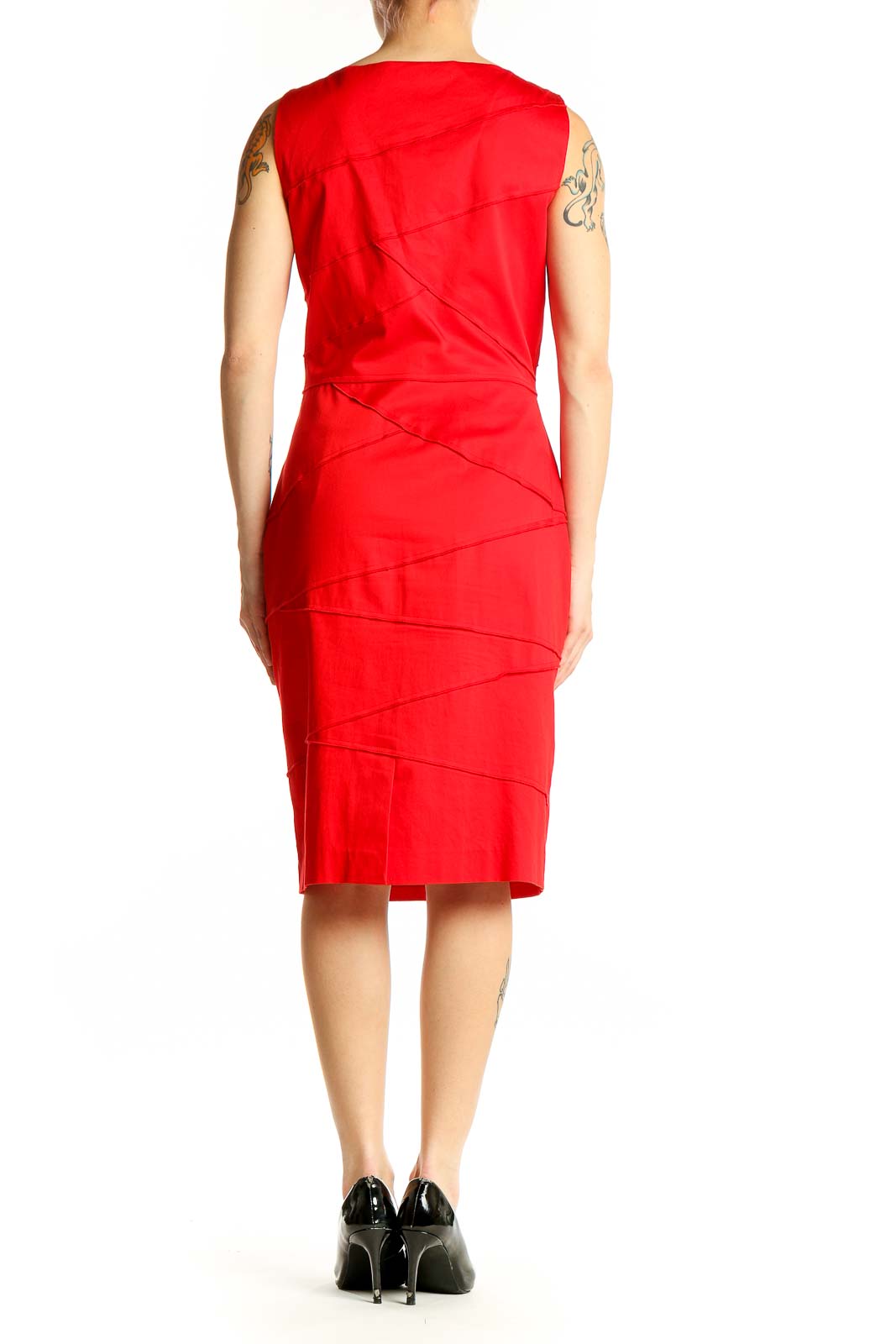 Side view of red sleeveless Calvin Klein bodycon dress showing figure-hugging silhouette