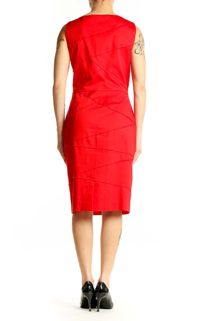 Side view of red sleeveless Calvin Klein bodycon dress showing figure-hugging silhouette