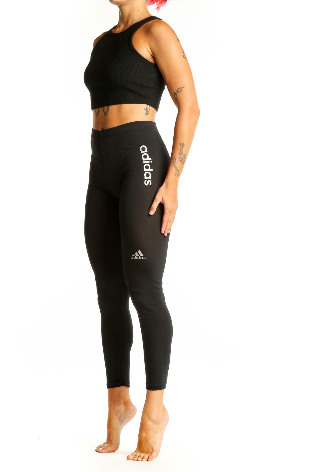Front view of black Adidas high-waisted performance leggings