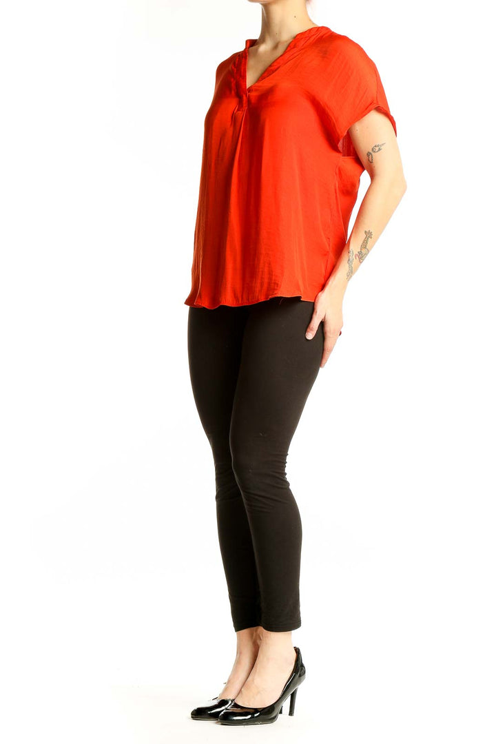Front view of red RACHEL Rachel Roy V-neck short sleeve blouse