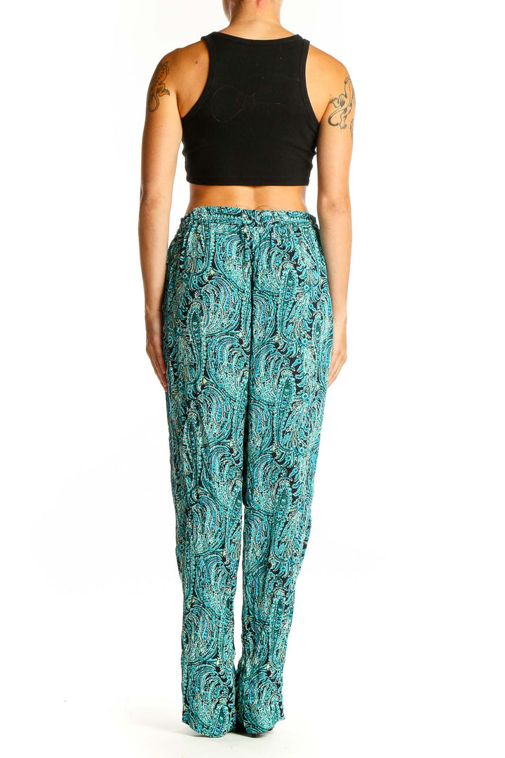 Side view of model wearing teal paisley print wide-leg pants from Talbots