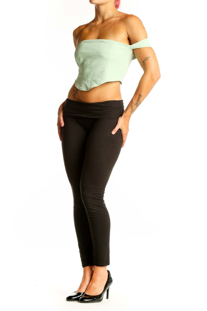 Front view of Cider mint green off-shoulder crop top on model