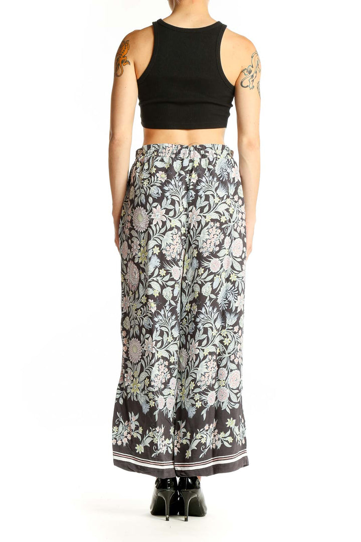 Side view of model wearing LOFT gray floral viscose wide-leg pants