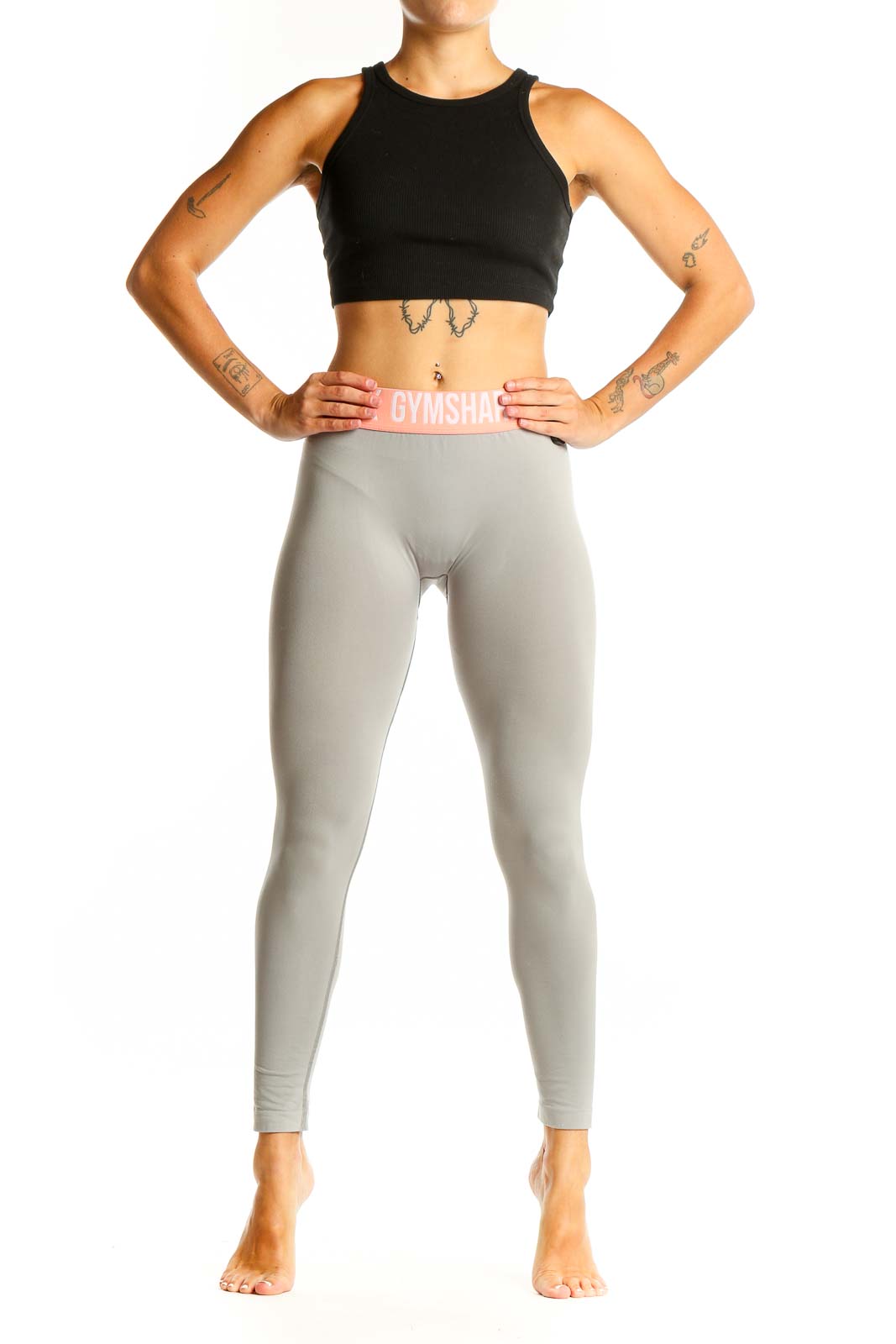 Front view of Gymshark gray high-waisted leggings with pink waistband