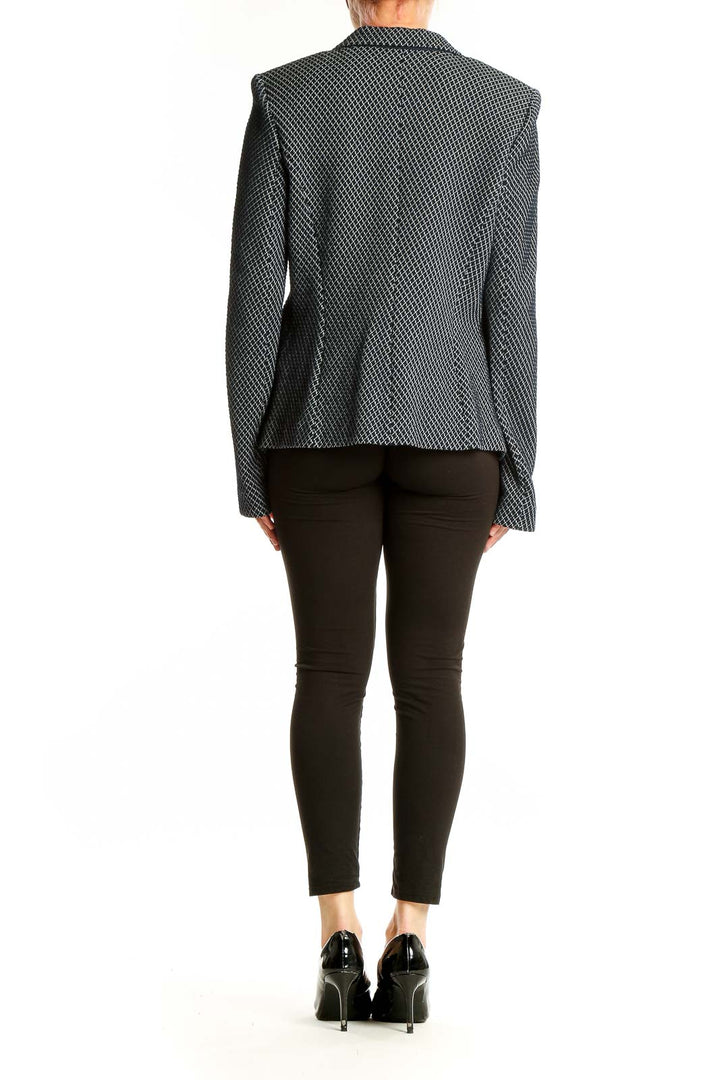 Side view of Armani Collezioni black textured fitted blazer on model