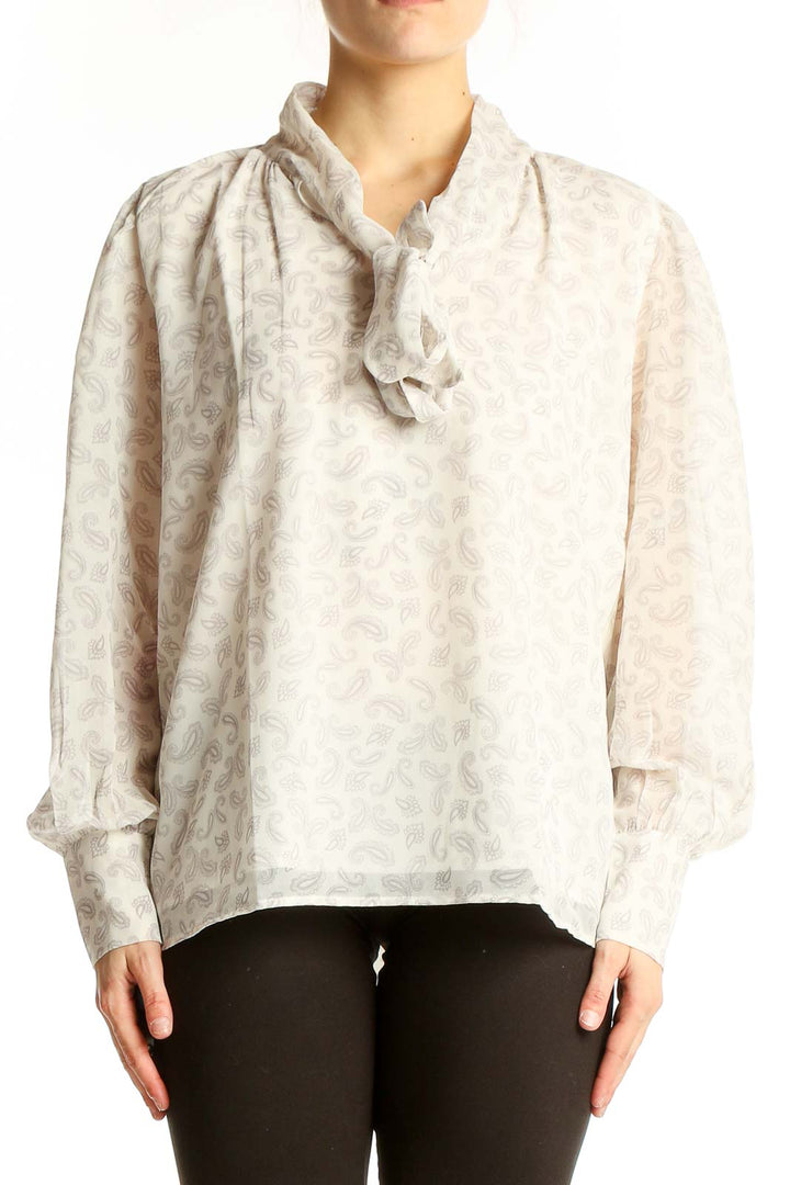 Front view of Ann Taylor white floral puff sleeve blouse with tie-neck