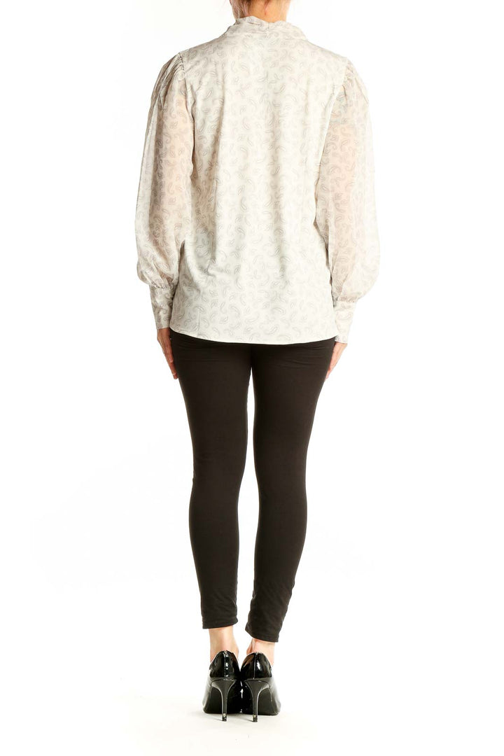 Side view of Ann Taylor white floral puff sleeve blouse showing relaxed fit