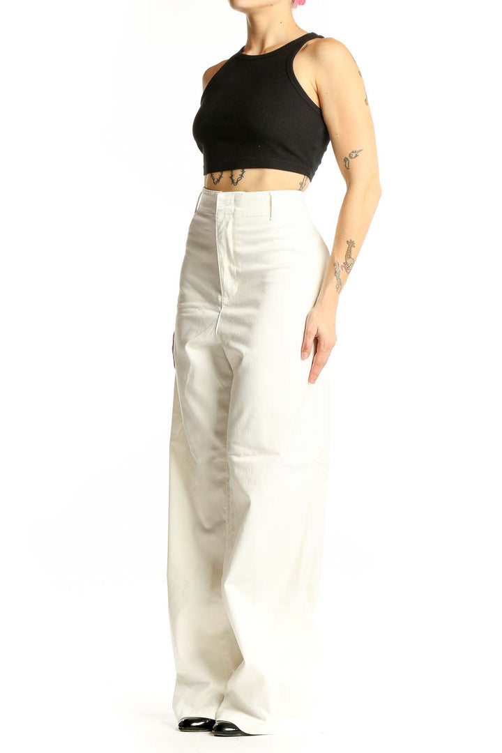 Front view of white high-waisted wide-leg denim pants
