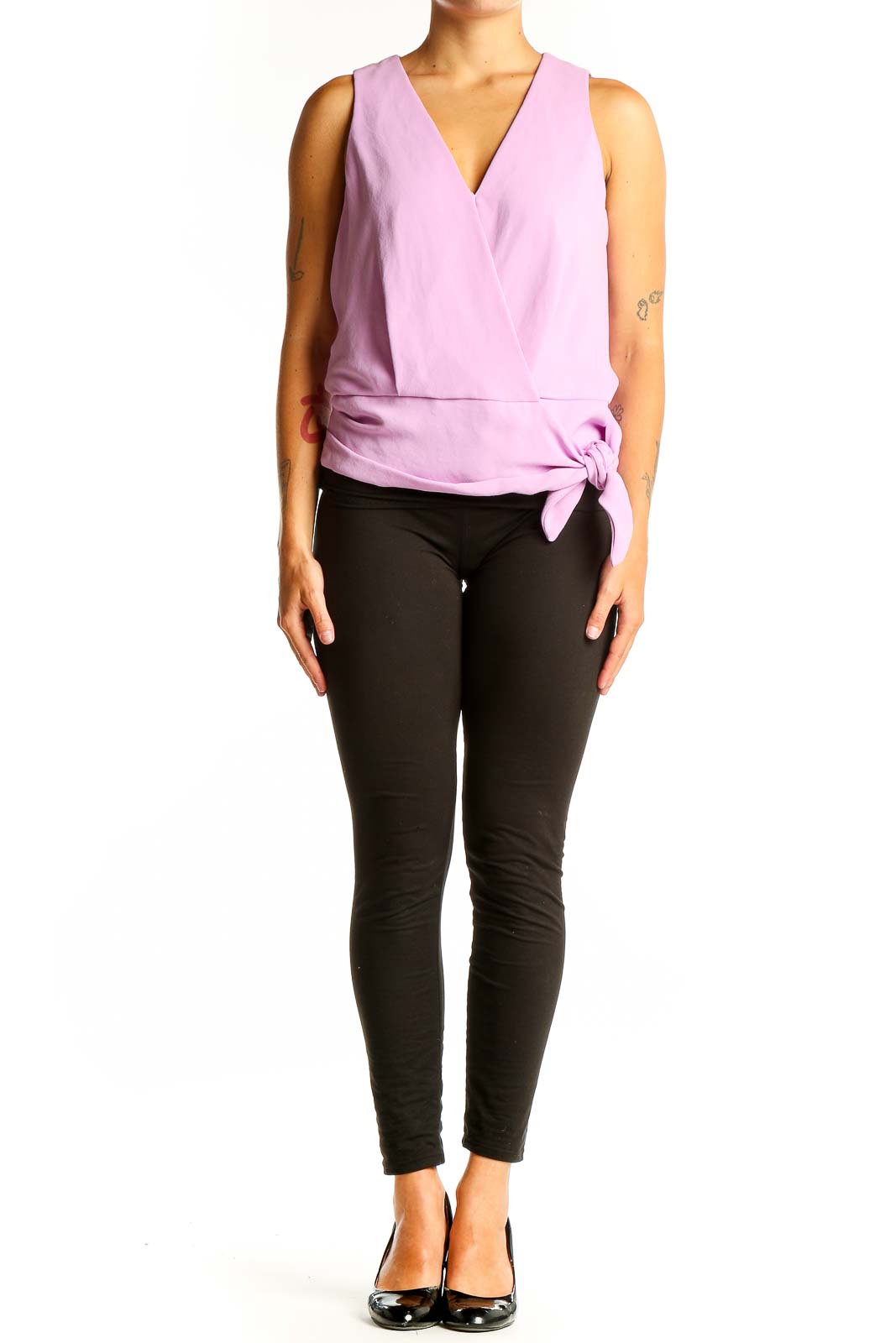 Front view of pink sleeveless wrap top by Trina Turk