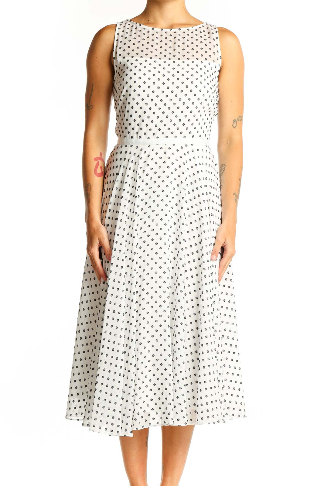 Front view of Hobbs London white sleeveless midi dress with black polka dots