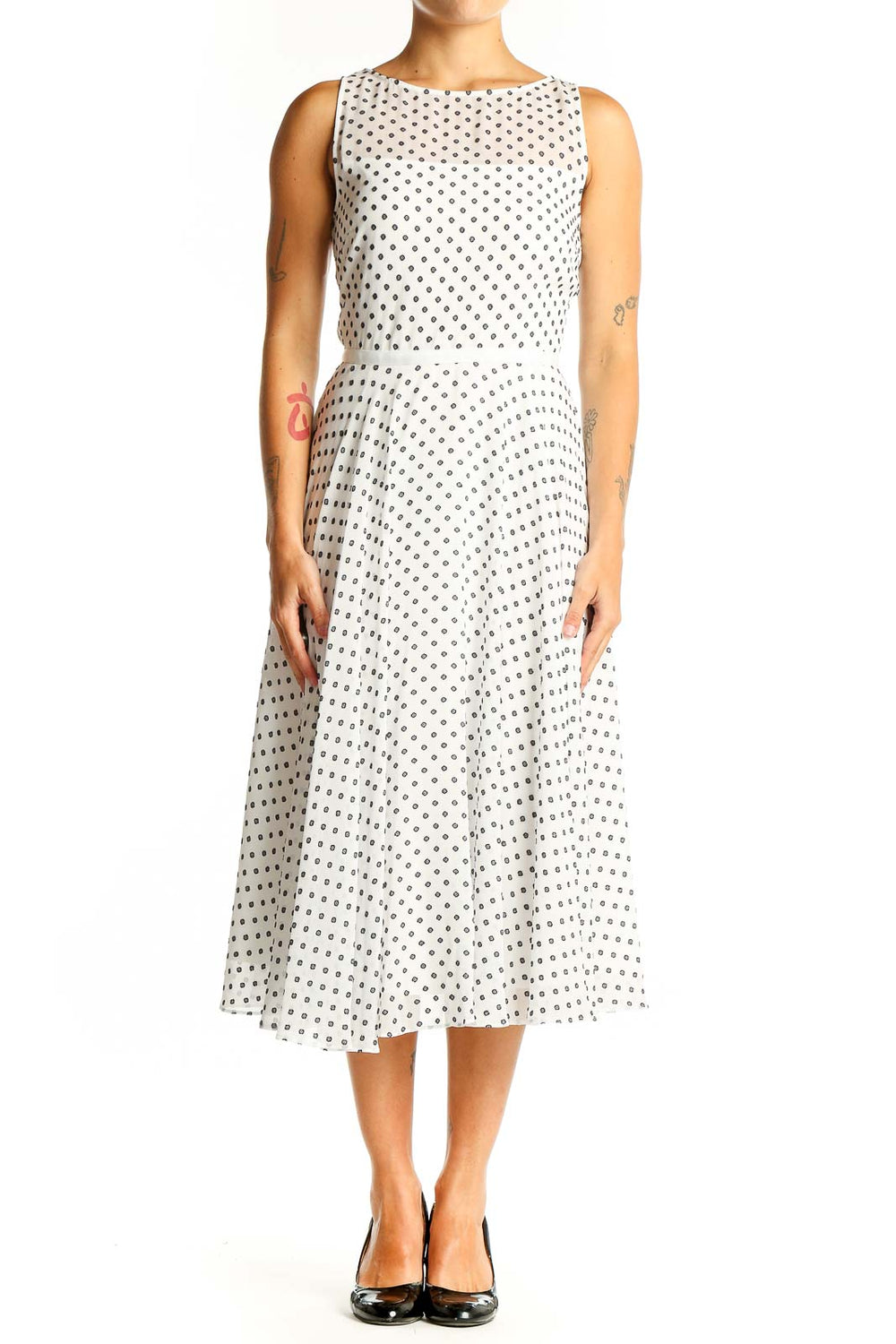 Front view of Hobbs London white sleeveless midi dress with black polka dots