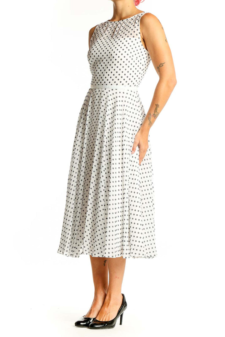 Front view of Hobbs London white sleeveless midi dress with black polka dots