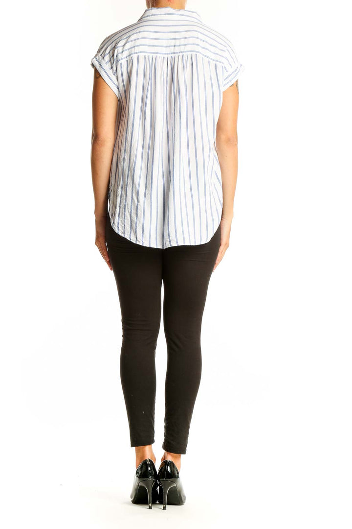 Side view of LOFT white and blue striped rayon blouse showing relaxed fit