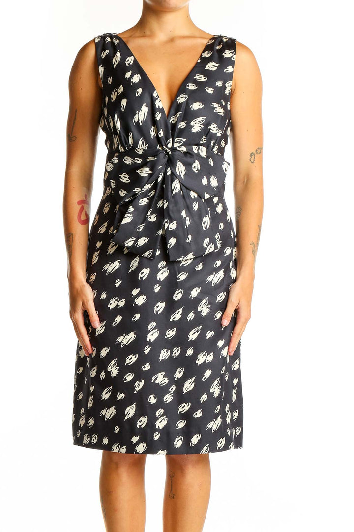 Front view of Kate Spade black silk cocktail dress with white floral print