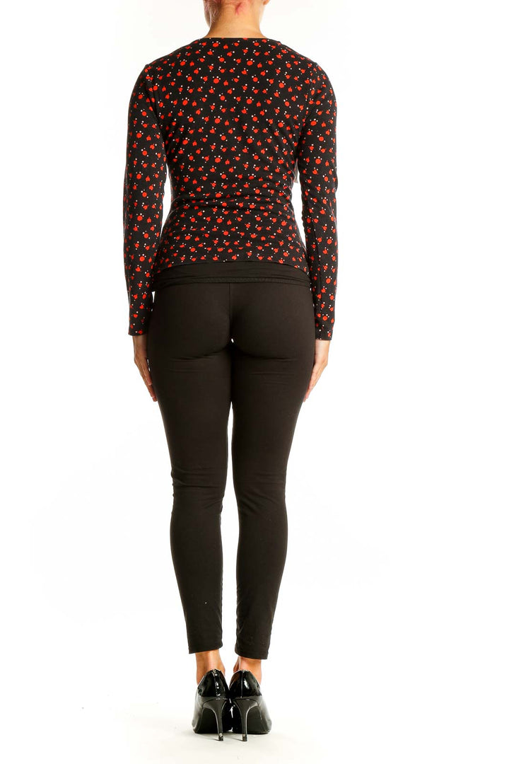 Back view of Boden black long-sleeved top with red cherry blossom print