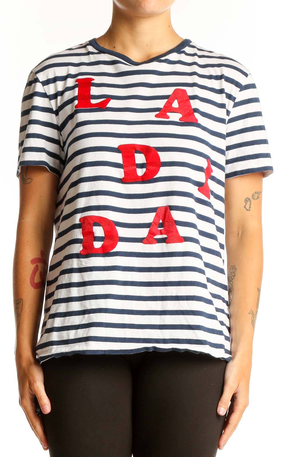 Front view of Etre cecile navy and white striped t-shirt with red LA DADA lettering