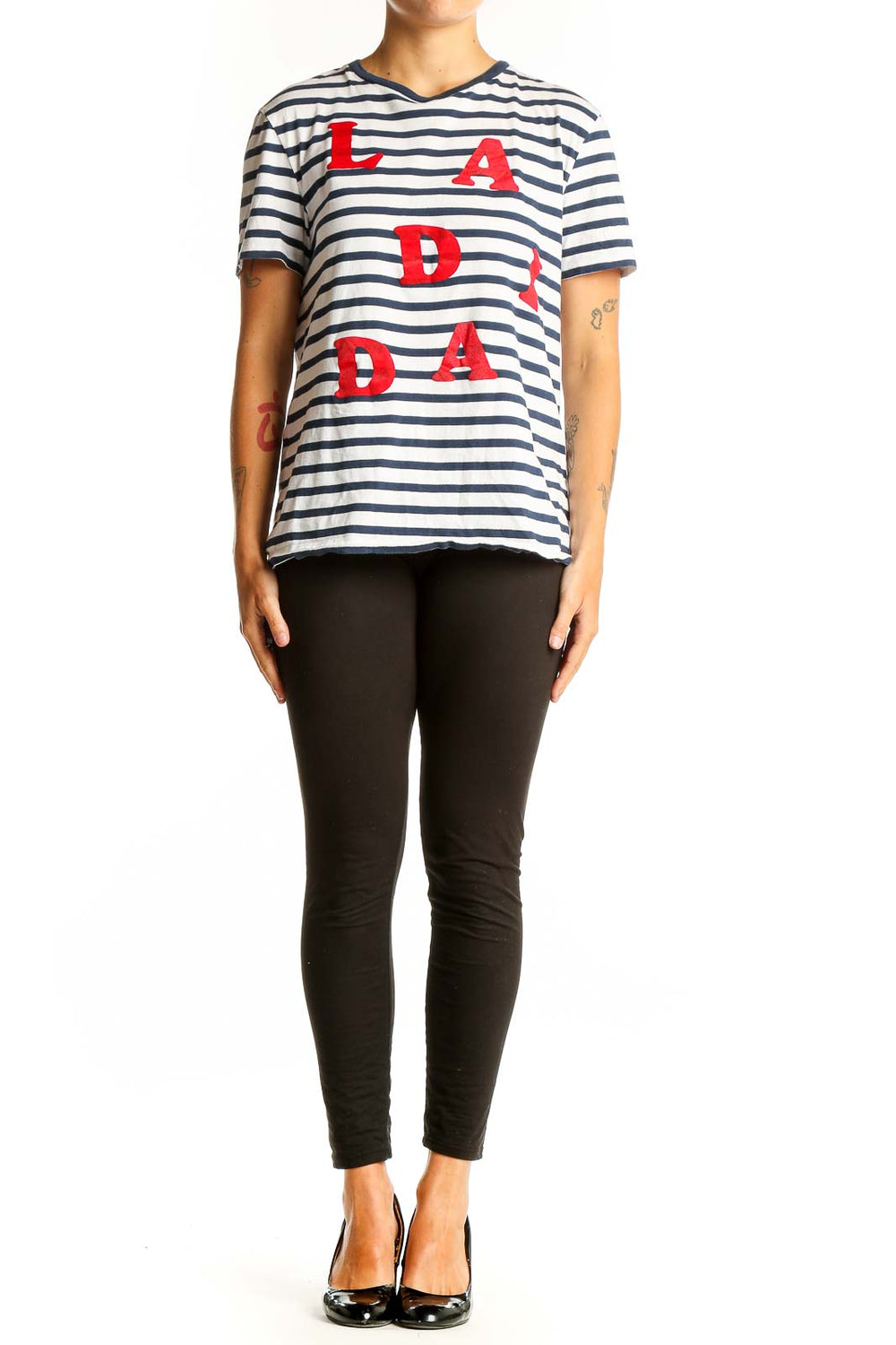 Front view of Etre cecile navy and white striped t-shirt with red LA DADA lettering