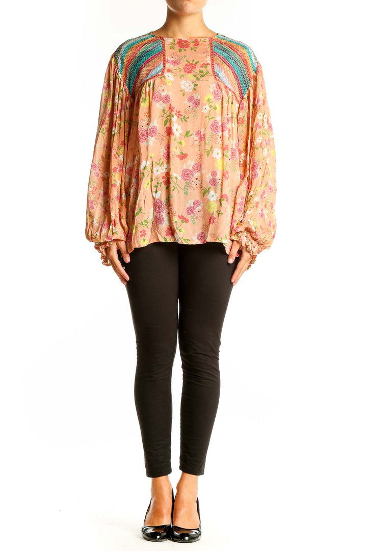 Front view of peach floral blouse with rainbow crochet shoulders