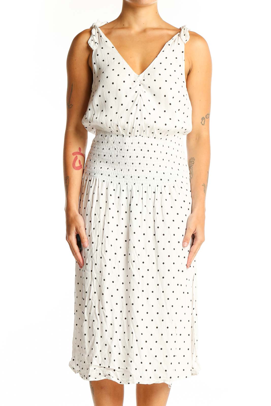 Front view of white polka dot midi dress with V-neck and tie shoulders
