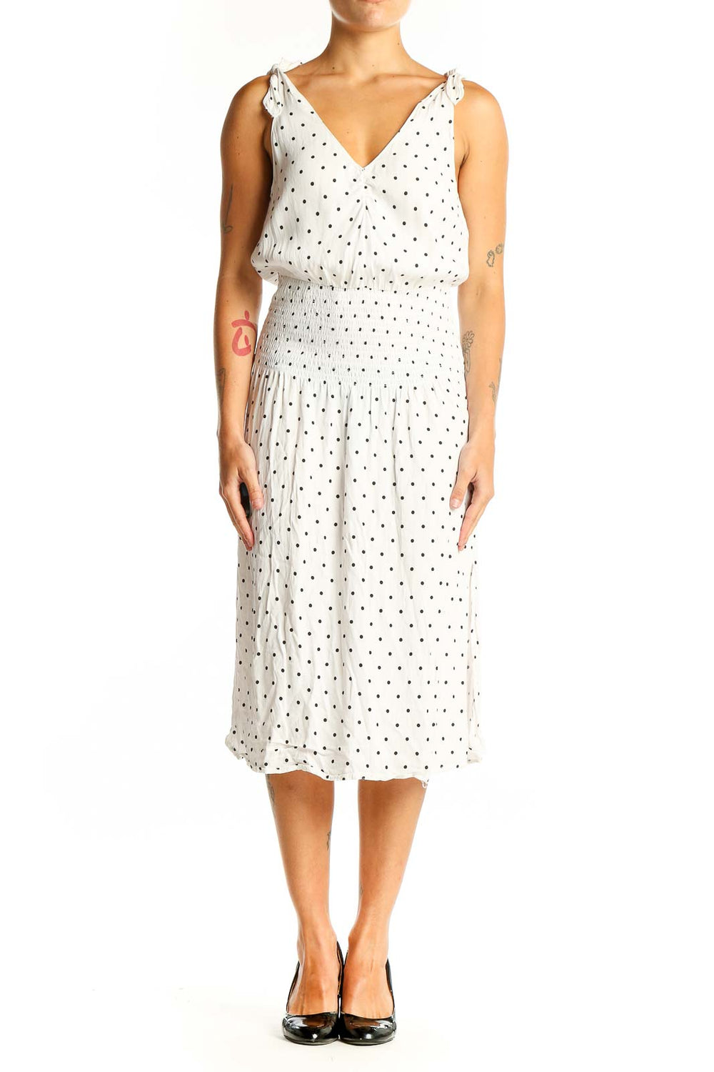 Front view of white polka dot midi dress with V-neck and tie shoulders