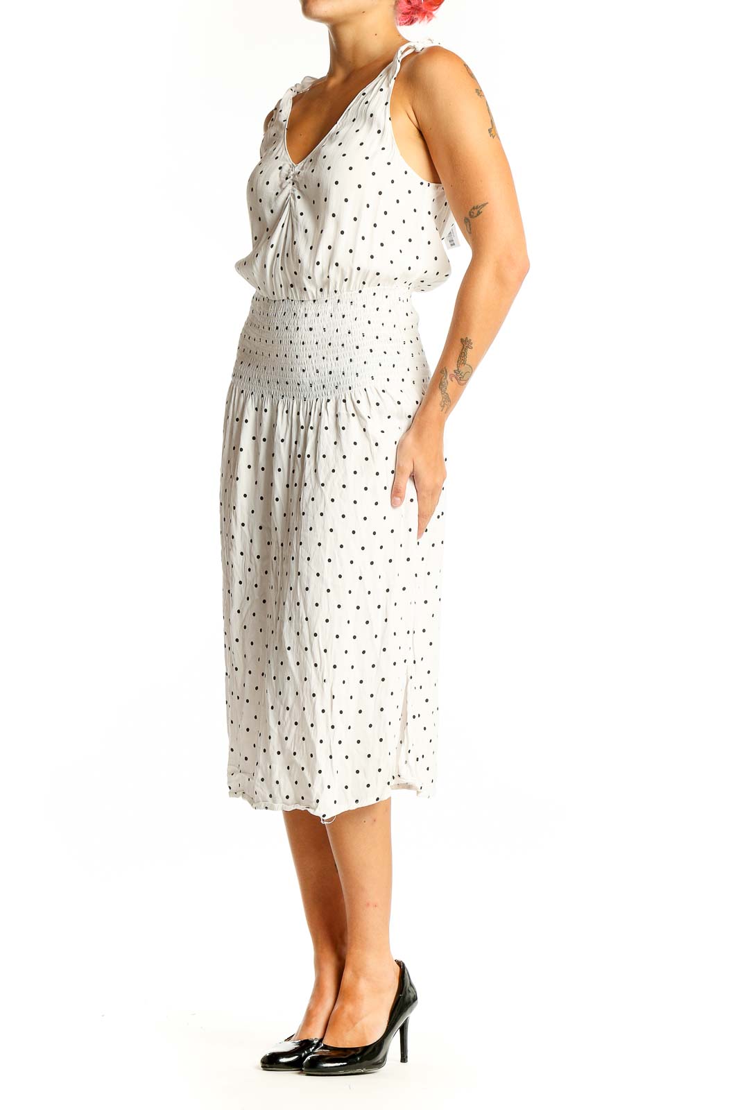 Front view of white polka dot midi dress with V-neck and tie shoulders
