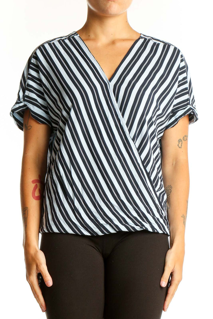 Front view of Ellen Tracy Black and White Striped Wrap Top with V-neckline