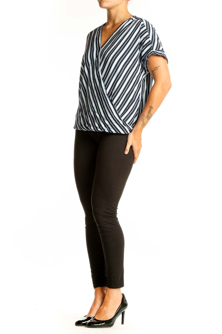 Front view of Ellen Tracy Black and White Striped Wrap Top with V-neckline