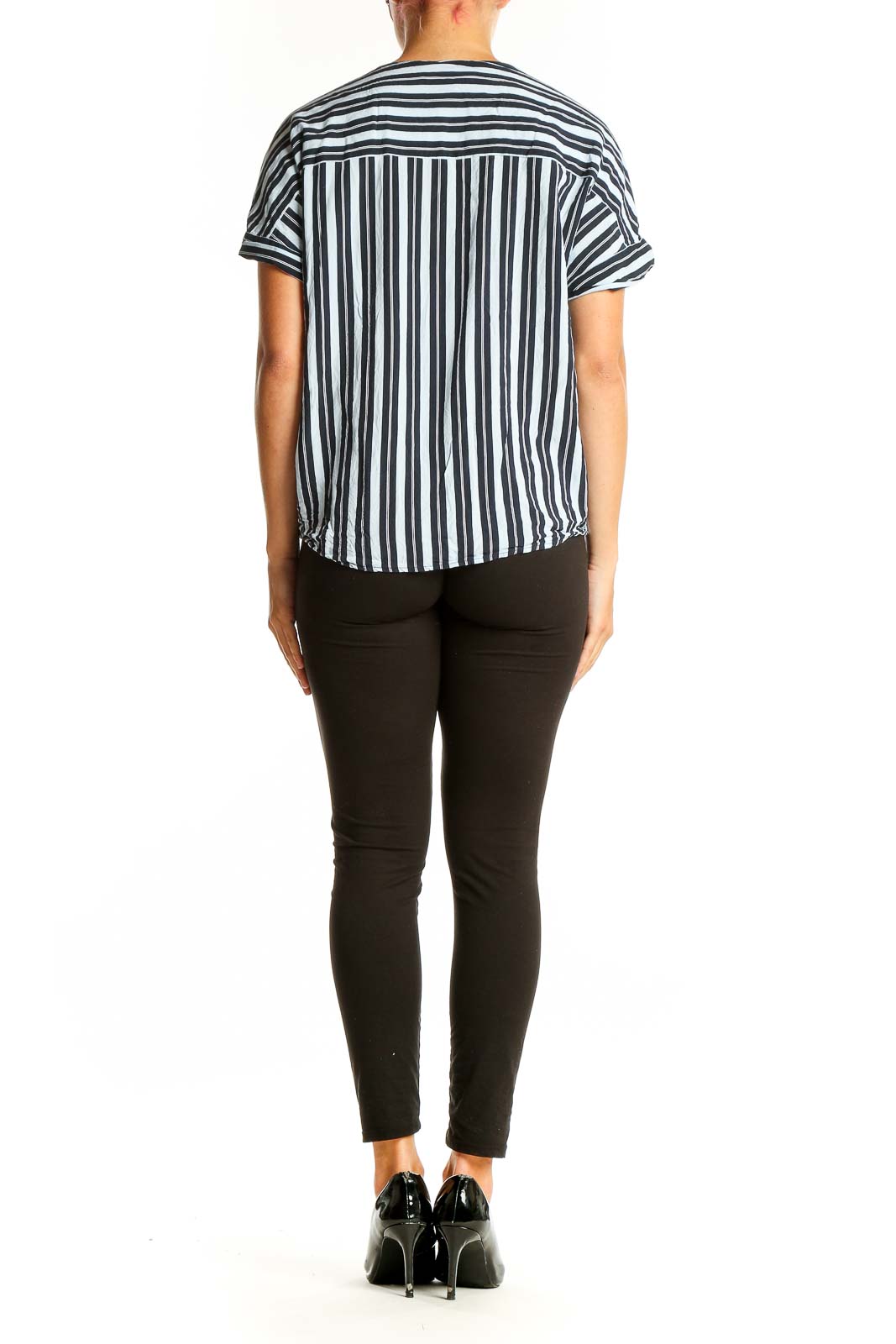 Side view of Ellen Tracy Black and White Striped Wrap Top on model with black pants