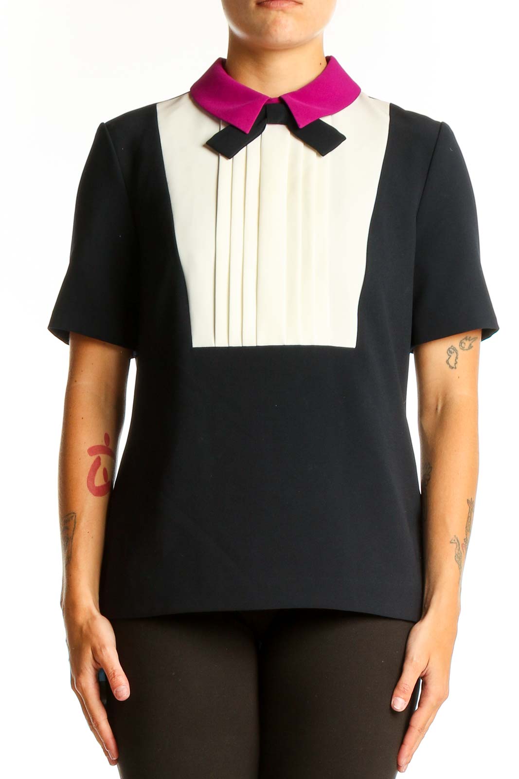 Front view of Ted Baker London black and white color-block top with pleated bib and fuchsia collar