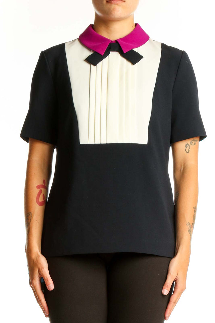 Front view of Ted Baker London black and white color-block top with pleated bib and fuchsia collar