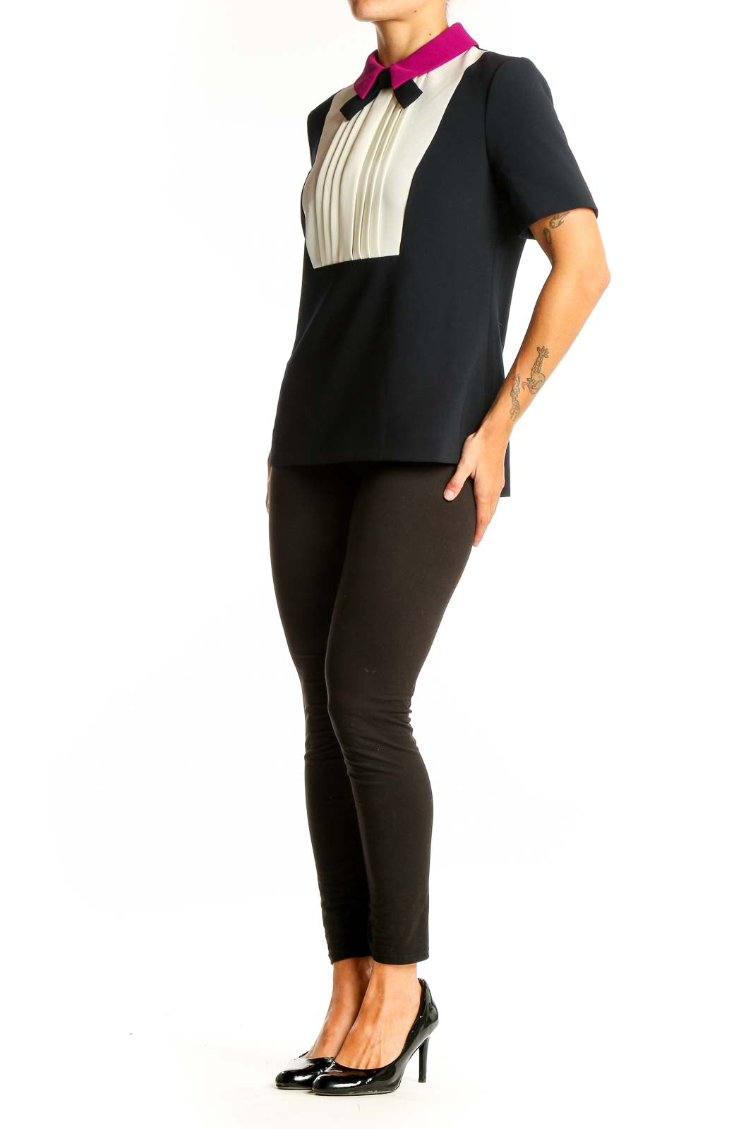 Front view of Ted Baker London black and white color-block top with pleated bib and fuchsia collar
