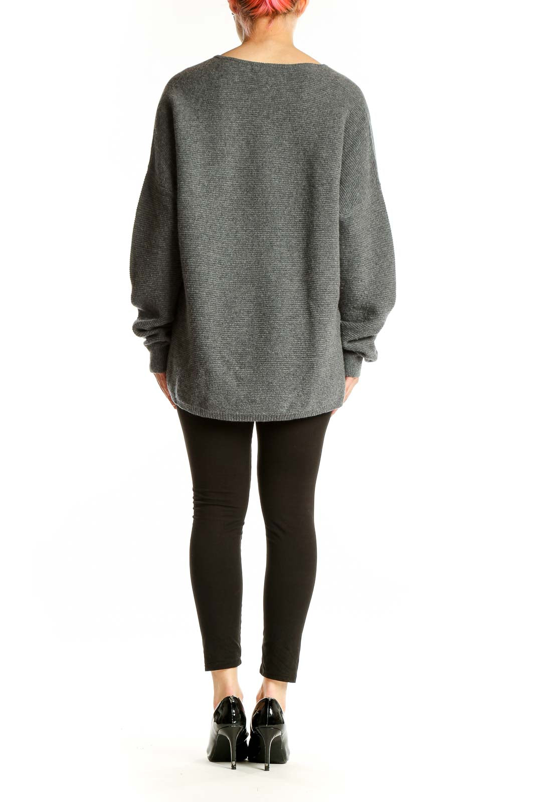 Side view of model wearing gray Nordstrom Signature cashmere V-neck oversized sweater with black pants