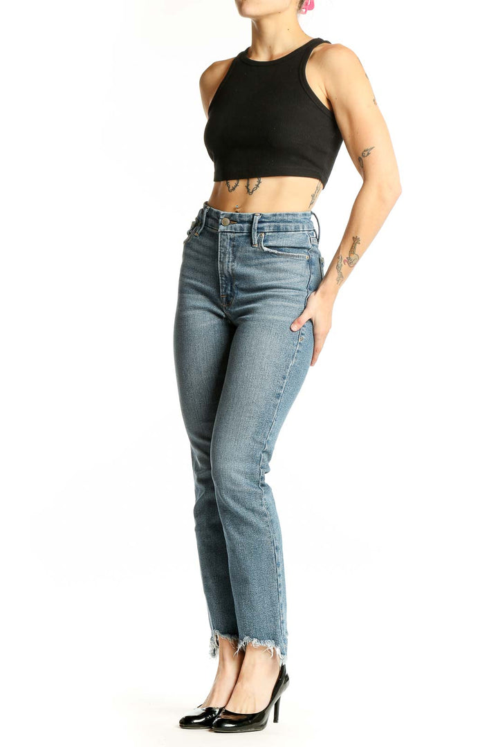 Front view of Good American light blue high-rise skinny jeans with distressed hem