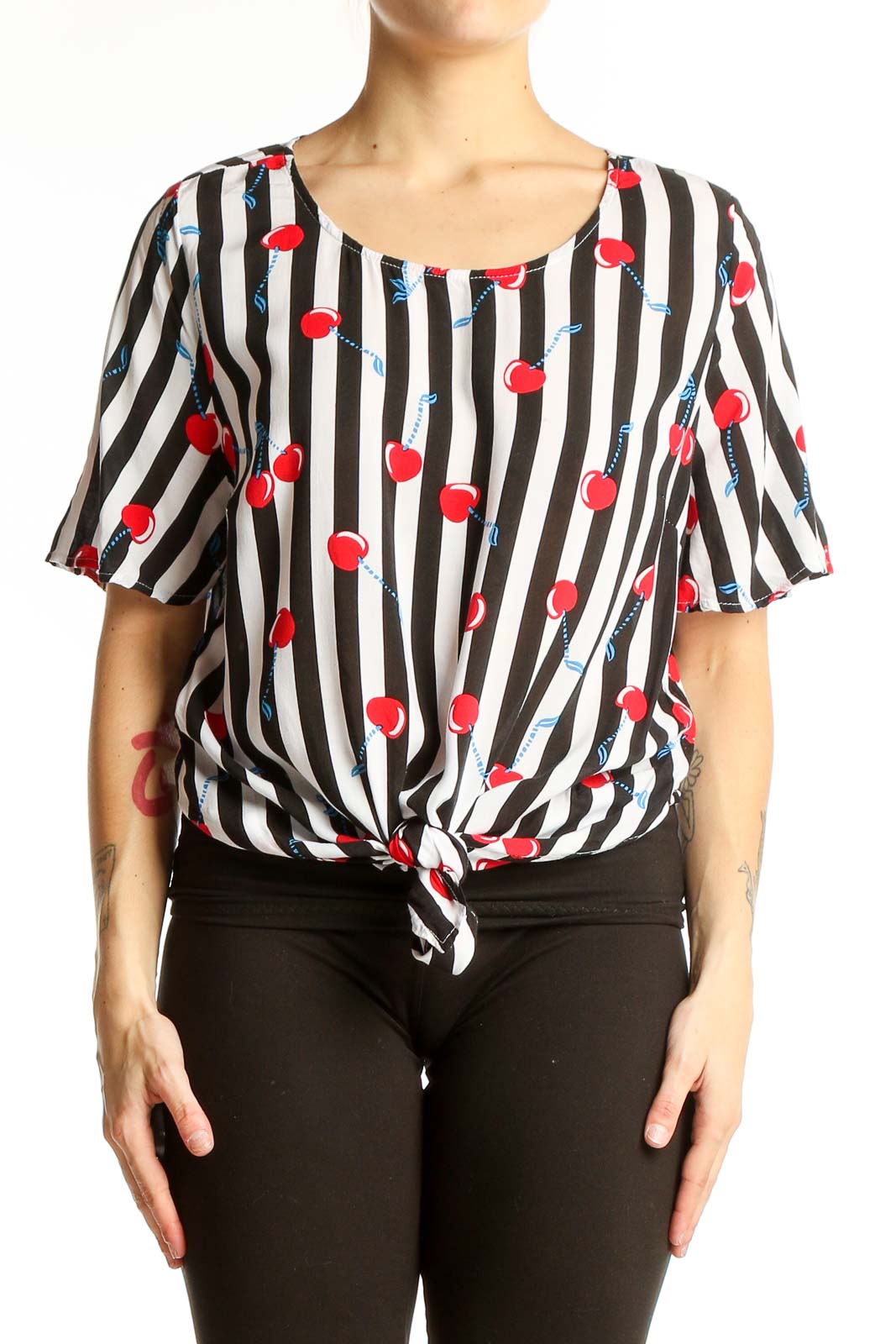 Front view of Cynthia Rowley black and white striped top with cherry print and tie-front detail