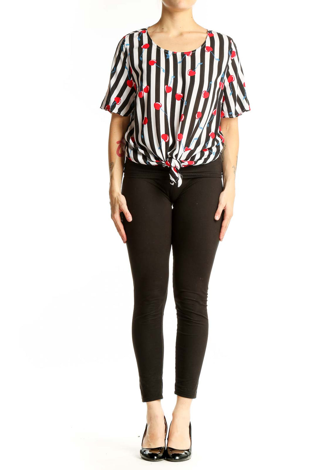 Front view of Cynthia Rowley black and white striped top with cherry print and tie-front detail