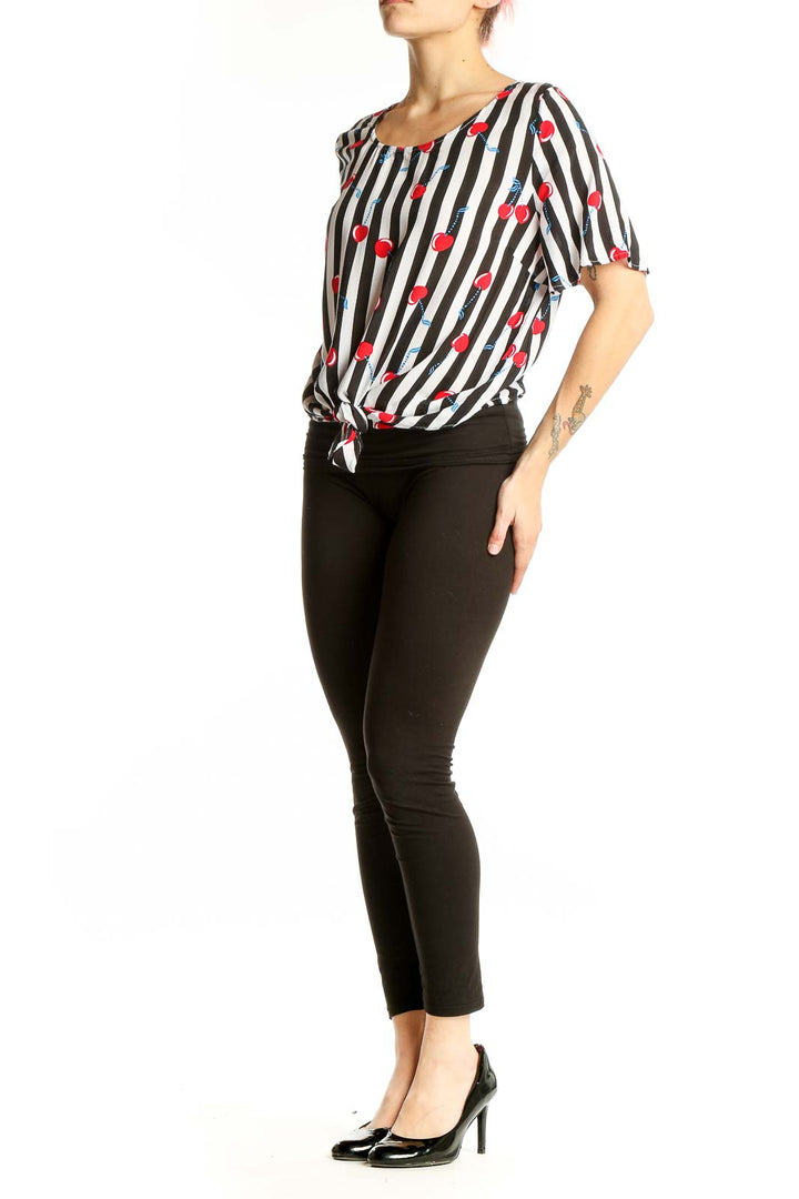 Front view of Cynthia Rowley black and white striped top with cherry print and tie-front detail