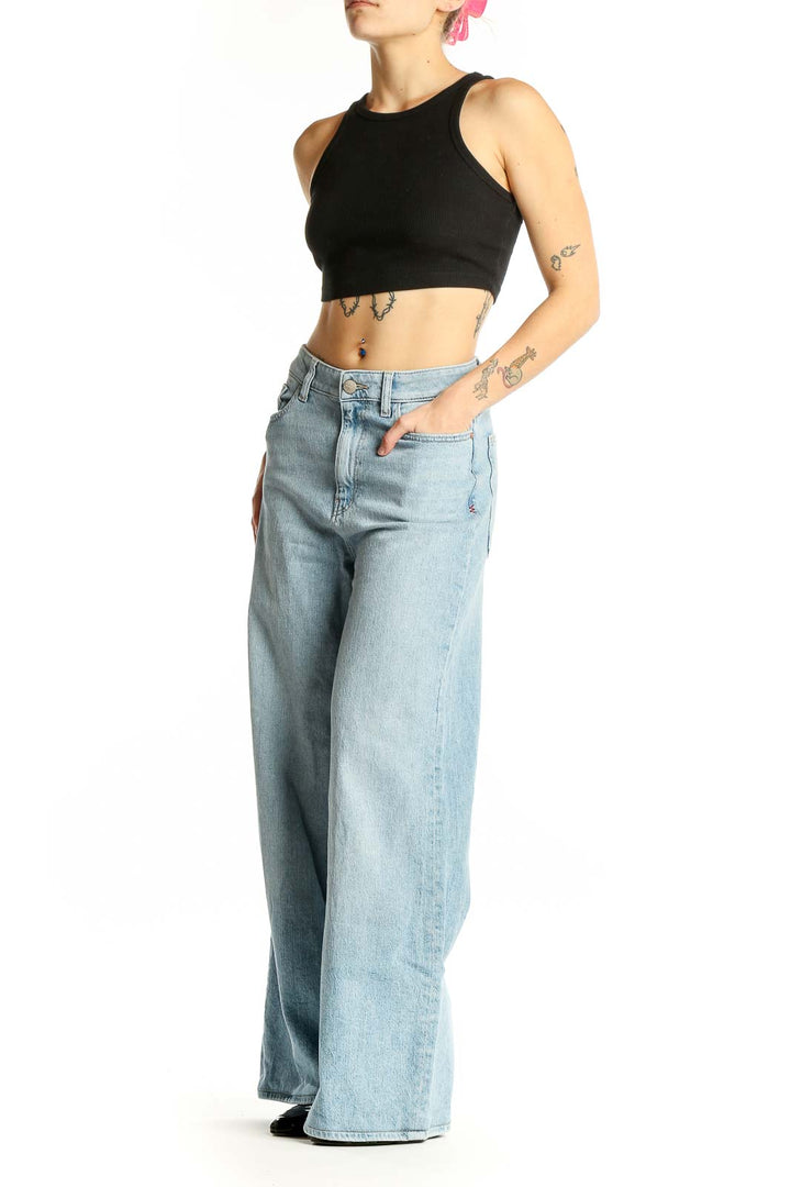 Front view of Warp Weft light blue wide-leg jeans on model