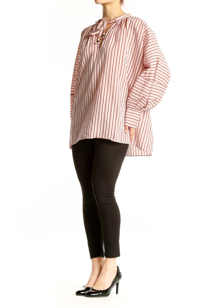 Front view of pink striped oversized blouse with tie-neck detail by BOSS by HUGO BOSS