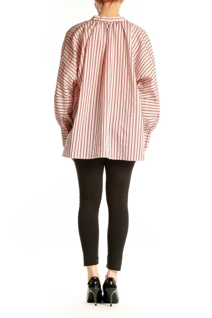 Back view of pink striped oversized blouse by BOSS by HUGO BOSS worn with black pants