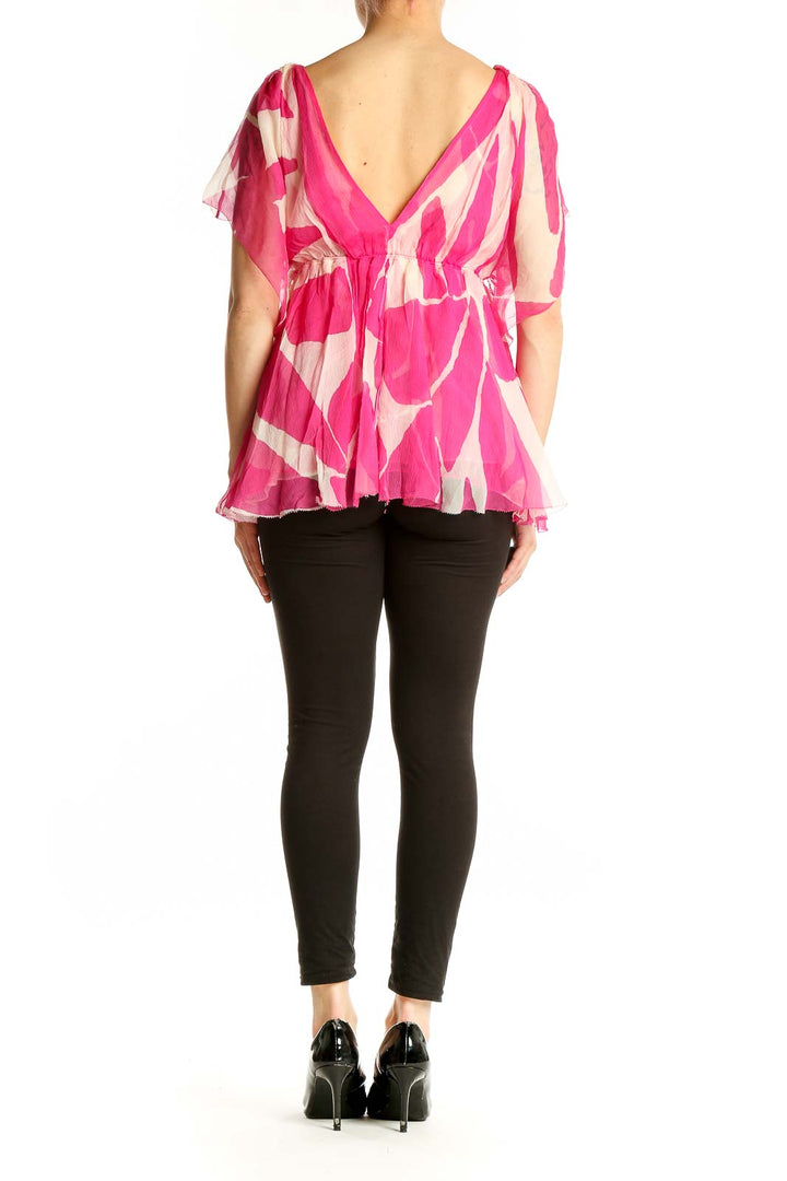 Back view of Diane von Furstenberg pink floral print silk blouse showing flowy design