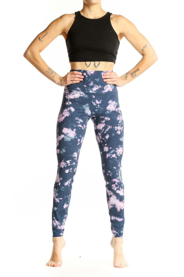 Front view of Lululemon navy and pink tie-dye high-waisted activewear leggings