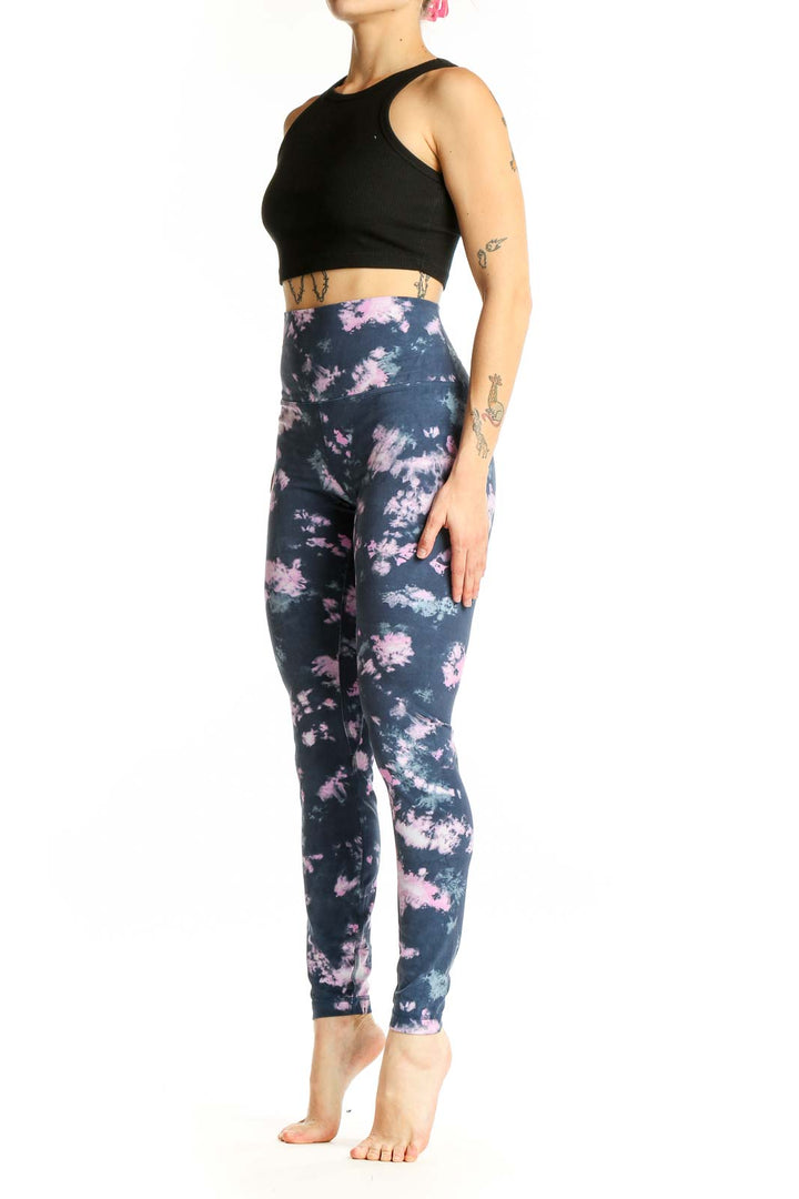 Front view of Lululemon navy and pink tie-dye high-waisted activewear leggings