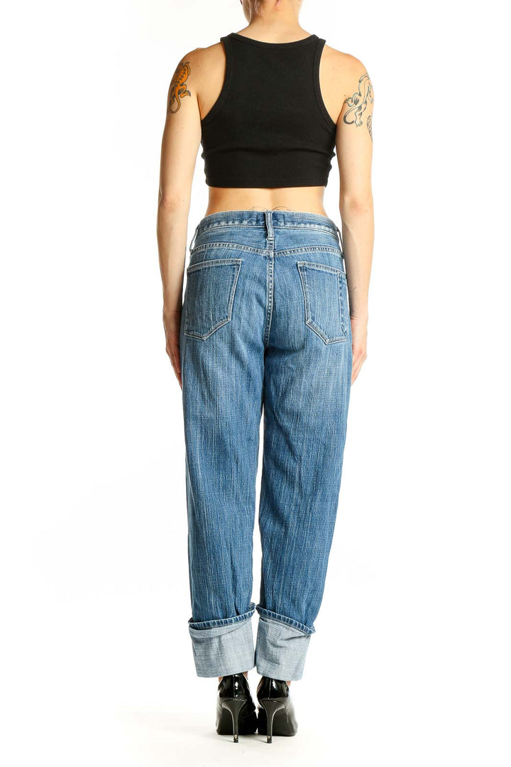 Side view of C/E Current/Elliott blue relaxed fit cuffed denim jeans on model