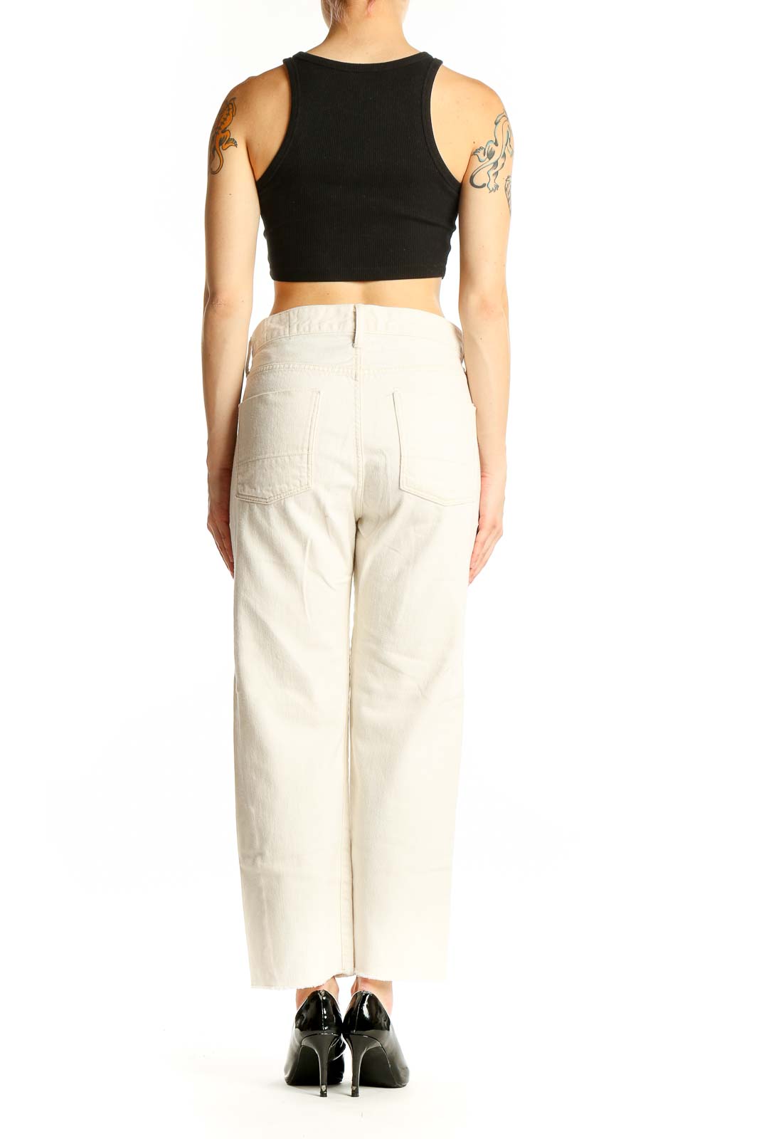 Side view of Vince cream cotton straight-leg jeans on model with black top