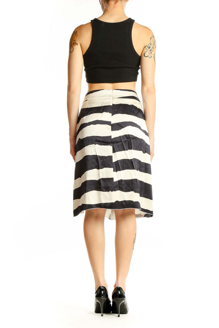 Side view of Armani Collezioni black and white zebra print silk wrap skirt on model