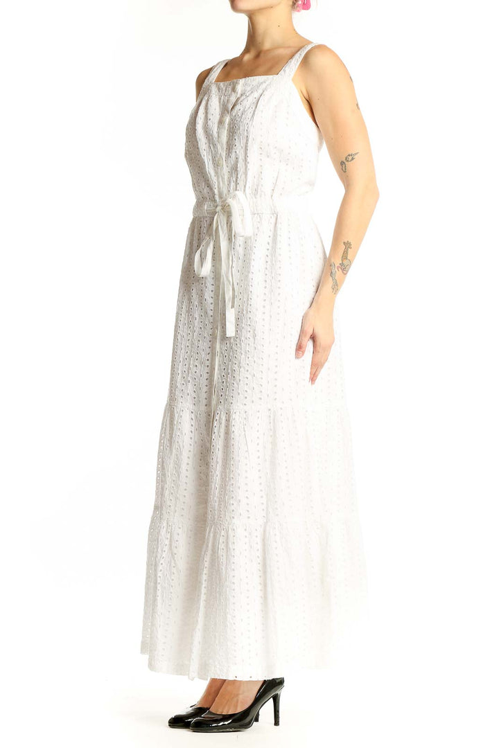 Front view of Gap white cotton eyelet maxi dress with wide straps and tiered skirt